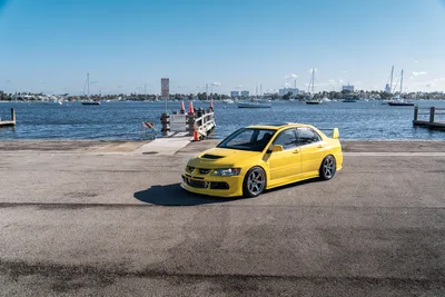 Yellow Mitsubishi Evo at Waterfront Marina - free cars & vehicles wallpaper 9504×6336