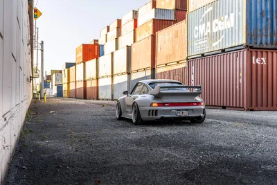 Silver Porsche 911 Parked Among Shipping Containers - free cars & vehicles wallpaper 9504×6336