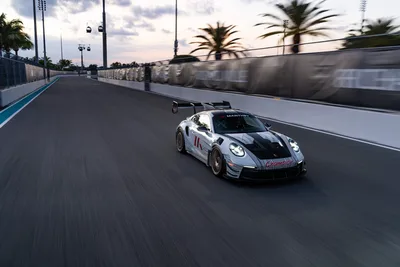 Porsche 911 GT3 Racing on Circuit Track at Dusk - free cars & vehicles wallpaper 9504×6336