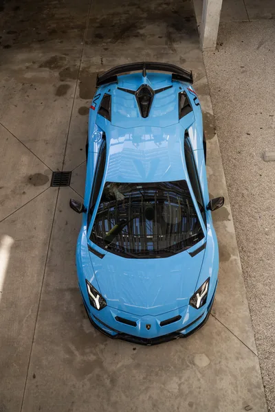 Overhead View of Blue Lamborghini Supercar in Parking Garage - free cars & vehicles wallpaper 6336×9504