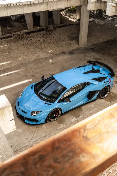 Blue Lamborghini Supercar Under Urban Bridge - free cars & vehicles wallpaper 6336×9504