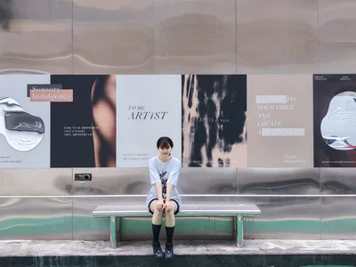 Young Woman Sitting on Bench Before Inspirational Wall Mural - free people & portraits wallpaper 4096×3072