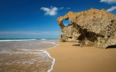Limestone Rock Formation on Sandy Beach with Ocean Waves - free landscapes wallpaper 6144×3840