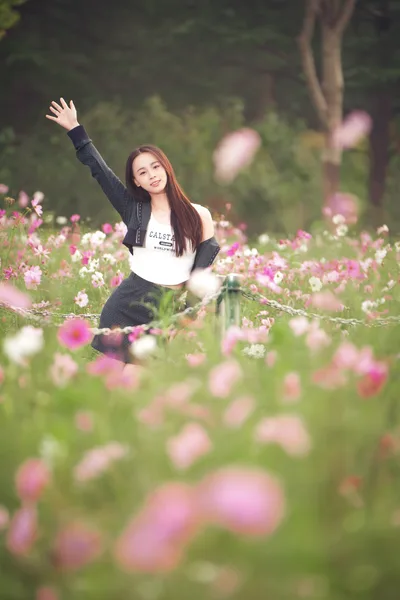 Girl in Flower Field with Raised Arm Pose - free wallpaper 2406×3607