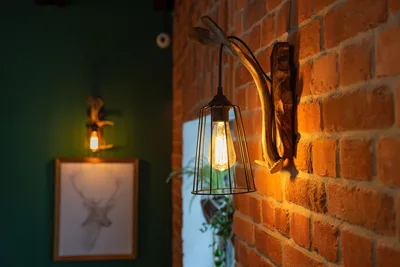 Hanging Pendant Lamp Against Brick Wall at Dusk - free city & urban wallpaper 2560×1707