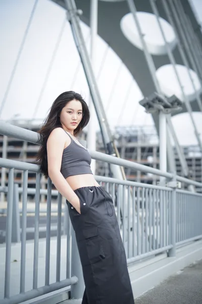 Woman in Athletic Wear on Modern Bridge - free people & portraits wallpaper 2731×4096