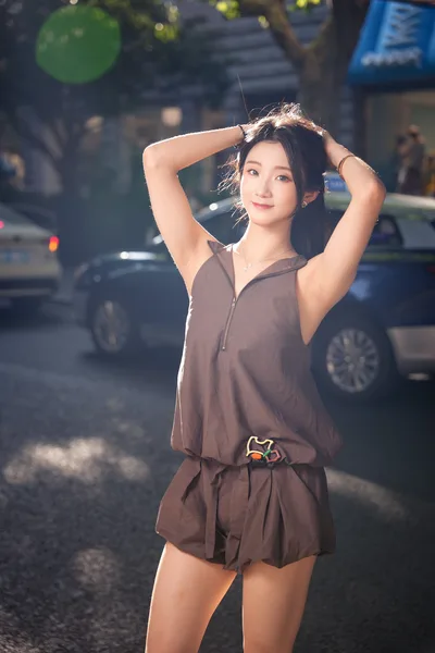 Woman Posing in Urban Street with Hands Behind Head - free people & portraits wallpaper 4096×6144