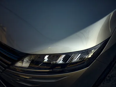 Modern Car Headlight Against Clear Blue Sky - free cars & vehicles wallpaper 6144×4608