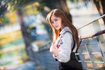 Young Woman Posing by Metal Railing in Sunlight - free people & portraits wallpaper 5760×3840