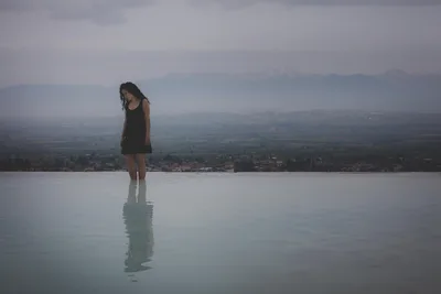 Woman Standing in Reflective Water with Mountain Valley - free people & portraits wallpaper 8688×5792