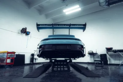 Porsche Sports Car Lifted In Industrial Garage - free cars & vehicles wallpaper 2048×1365