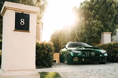 Luxury Green Sports Car at Modern Residential Gate - free cars & vehicles wallpaper 5300×3500