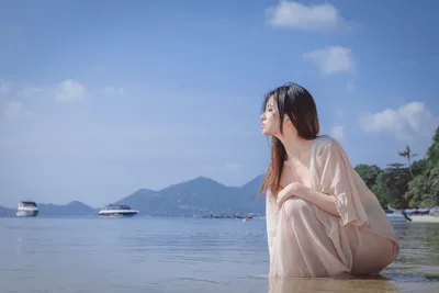 Woman in Beige Dress Wading in Coastal Waters - free wallpaper 6000×4000