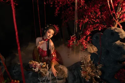 Woman in Red Dress Among Glowing Crimson Vines - free wallpaper 9504×6336