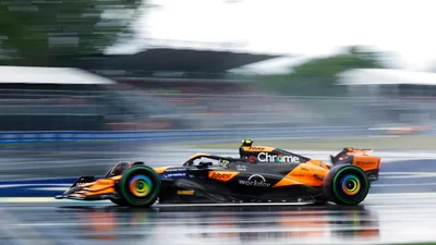 McLaren F1 Race Car in Motion on Wet Track - free cars & vehicles wallpaper 3840×2160