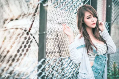 Girl Posing Against Chain-Link Fence - free wallpaper 5760×3840