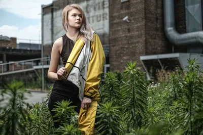Young Woman in Yellow Jacket Among Urban Garden Plants - free people & portraits wallpaper 6000×4000