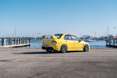 Yellow Sports Car at Waterfront Marina - free cars & vehicles wallpaper 9504×6336