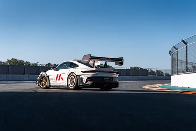 White Race Car With Rear Wing on Race Track - free cars & vehicles wallpaper 9504×6336