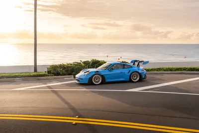 Blue Porsche 911 GT3 Parked at Seaside Promenade - free cars & vehicles wallpaper 9504×6336