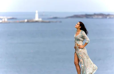Woman in Floral Dress Gazing at Coastal Lighthouse - free people & portraits wallpaper 6143×3996