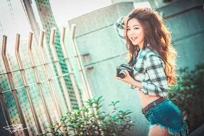 Young Woman with Camera Against Turquoise Building - free people & portraits wallpaper 5760×3840