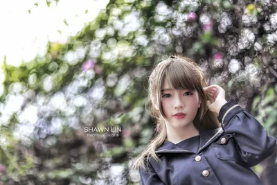 Young Woman in Navy Jacket Among Flowering Vines - free people & portraits wallpaper 5760×3840