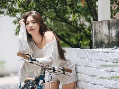Woman in White Sweater With Bicycle by Stone Wall - free people & portraits wallpaper 4096×3072