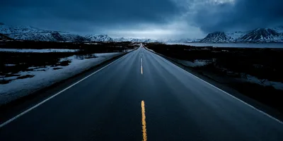 Empty asphalt road leading to snowy mountains - free city & urban wallpaper 9066×4533