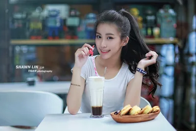 Young Woman Enjoying Beverage at Café Table - free people & portraits wallpaper 5760×3840