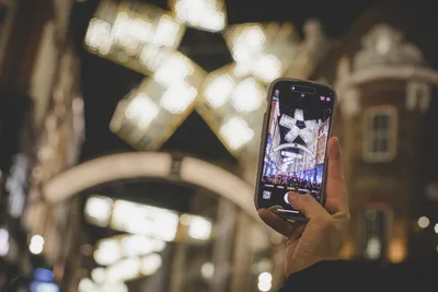 Person Photographing Illuminated Street at Night - free city & urban wallpaper 8688×5792