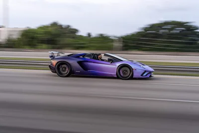 Purple Lamborghini Roadster Speeding On Highway - free cars & vehicles wallpaper 9504×6336