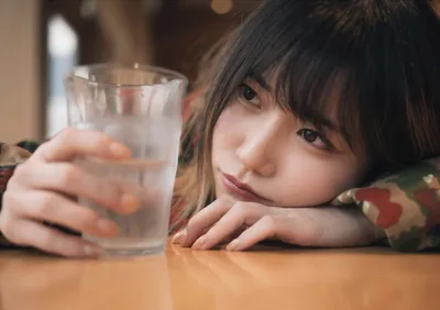 Young Girl Holding Glass of Water at Table - free people & portraits wallpaper 2022×1428
