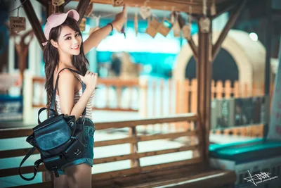 Young Woman in Pink Cap at Wooden Waterfront Pavilion - free people & portraits wallpaper 5760×3840