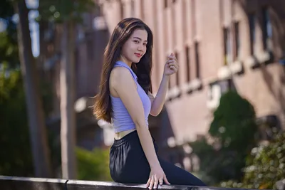 Woman in Blue Top Posing on Urban Street - free people & portraits wallpaper 5120×3413