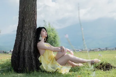 Woman in Yellow Dress Sitting by Tree in Rural Valley - free people & portraits wallpaper 6000×4000