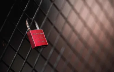 Red Love Lock on Black Metal Fence - free photography wallpaper 2400×1508