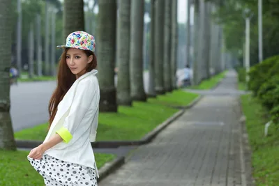 Young Woman in Floral Cap Walking on Tree-Lined Path - free people & portraits wallpaper 3814×2543