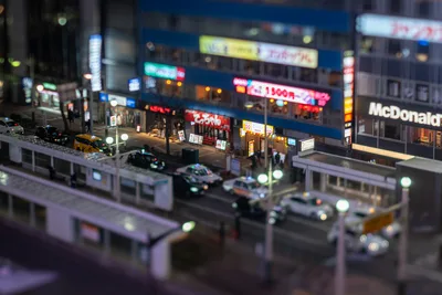 Nighttime Urban Street Scene With Neon Signs and Traffic - free city & urban wallpaper 5568×3712