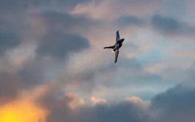 Fighter Jet Banking Through Cloudy Sky at Sunset - free cars & vehicles wallpaper 3933×2458
