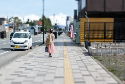 Woman Walking on Japanese Sidewalk with White Car - free city & urban wallpaper 5568×3712