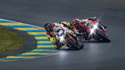 Motorcycle Racing in Rain at Le Mans Circuit - free cars & vehicles wallpaper 4321×2431