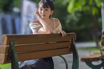 Young Woman Sitting on Wooden Bench in Park - free people & portraits wallpaper 5120×3413