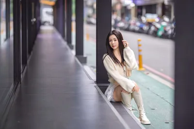 Woman in White Cardigan Posing on Urban Sidewalk - free wallpaper 5120×3418
