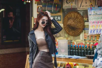 Woman in Black Leather Jacket at Asian Shop Display - free people & portraits wallpaper 5120×3418