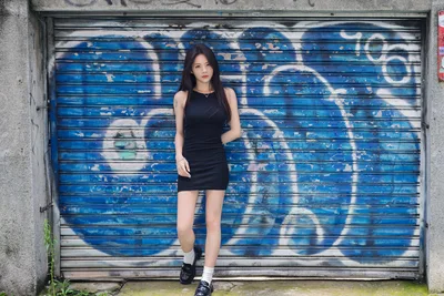 Woman in Black Dress Against Blue Graffiti Shutter - free people & portraits wallpaper 5120×3413