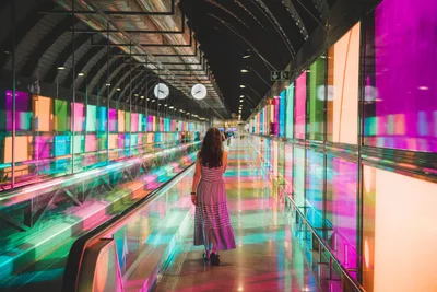 Woman in Colorful Neon-Lit Modern Corridor - free people & portraits wallpaper 8688×5792