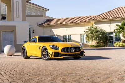 Bright Yellow Mercedes-AMG Sports Car in Luxury Driveway - free cars & vehicles wallpaper 9504×6336