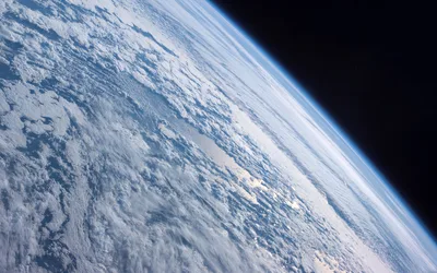 Earth's Gentle Curve from Orbit - free space wallpaper 5120×3200