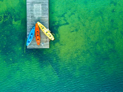 Colorful Kayaks at the Wooden Pier - free photography wallpaper 3992×2992